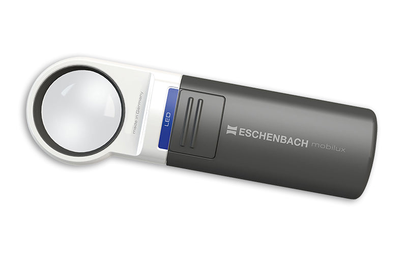 A handheld magnifying glass with a white circular frame and a dark gray body, featuring the Eschenbach MobiLux logo and a blue LED sign, shown on a plain white background. Model 151110