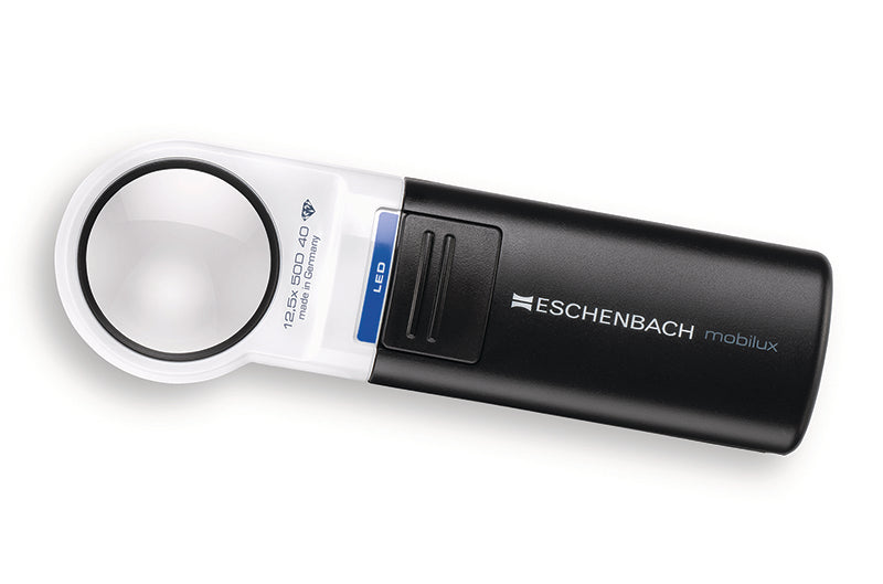 A black and white Eschenbach Mobilux magnifying loupe with a blue LED sign, shown on a clean white background. Model 15112