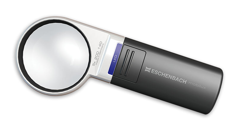 A handheld Eschenbach magnifying glass with a silver and black body, featuring a blue LED sign, shown on a plain white background. Model 15115