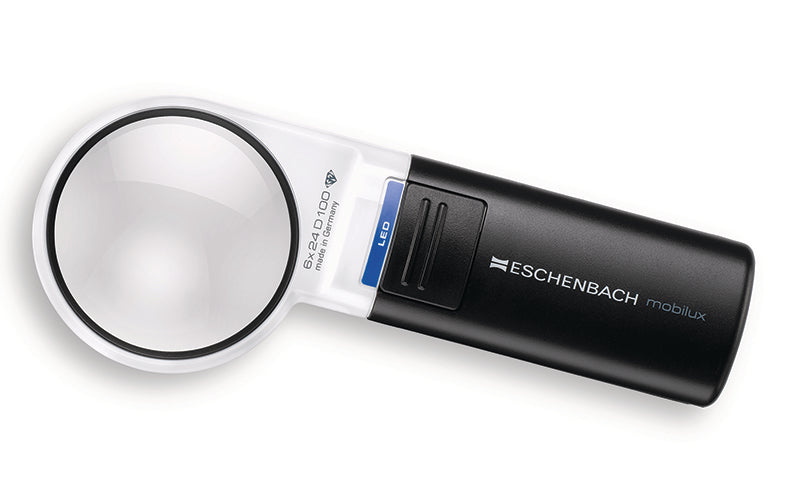 A black and white Eschenbach Mobilux handheld magnifier with a clear lens, shown on a plain white background. Model 15116