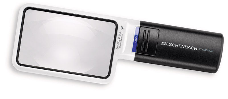 A handheld Eschenbach magnifier with a white frame and a black handle, featuring a blue accent button and white branding.