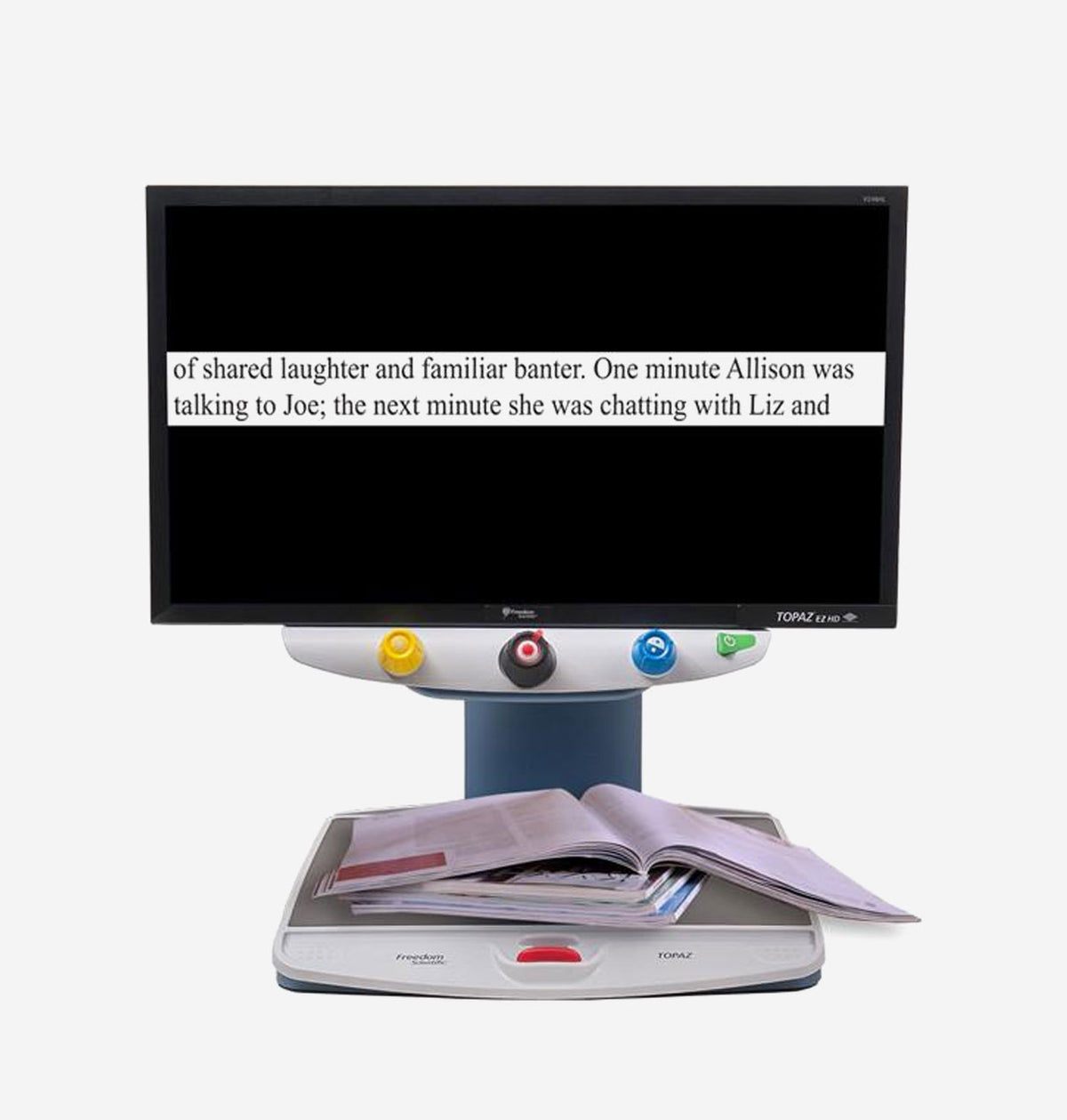 Topaz 24XL HD with a screen displaying text on a white background with magazine below