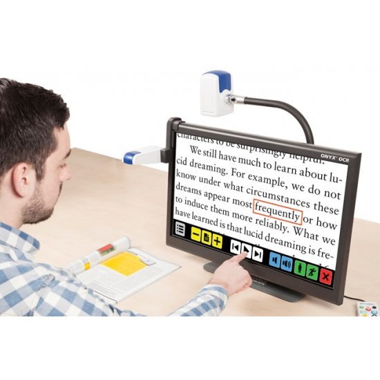 Person using a Topaz magnifier to read a magazine
