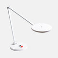 White LED desk lamp on a light gray background