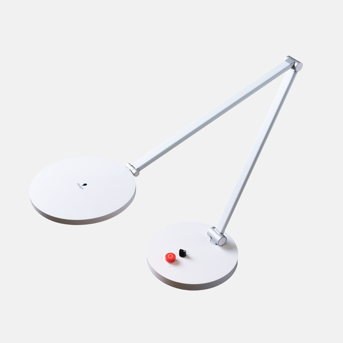 A modern white adjustable desk lamp with two circular lamp heads and a slim articulated arm, shown on a light gray background.