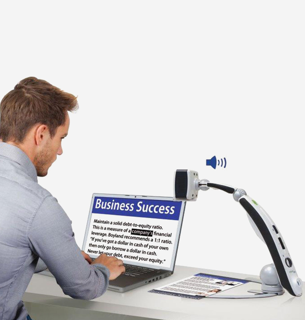 Man using a laptop with text displayed on the screen, sitting at a desk with a Transformer HD-Wifi OCR 