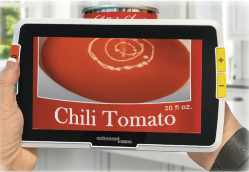 Using Amigo magnifier to view the front of a can labelled Chili Tomato