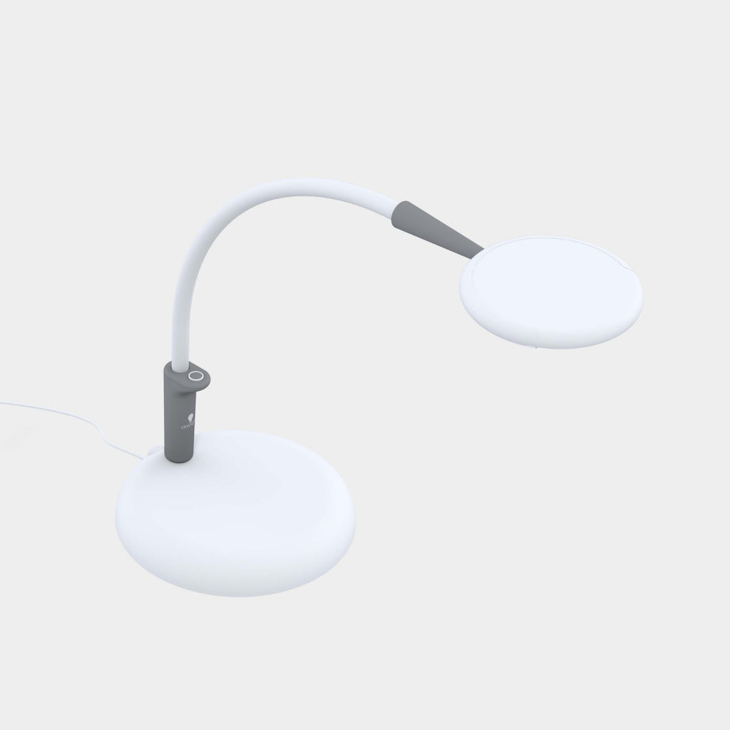 White lamp with a flexible neck on a light gray background