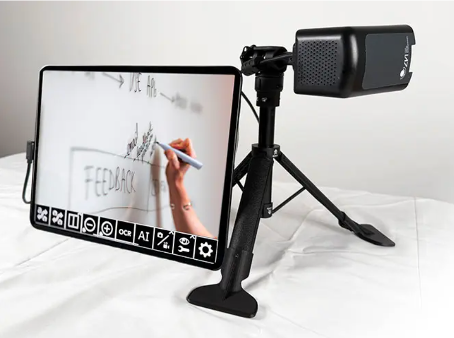 MagniLink Mini on table with whiteboard on the screen
