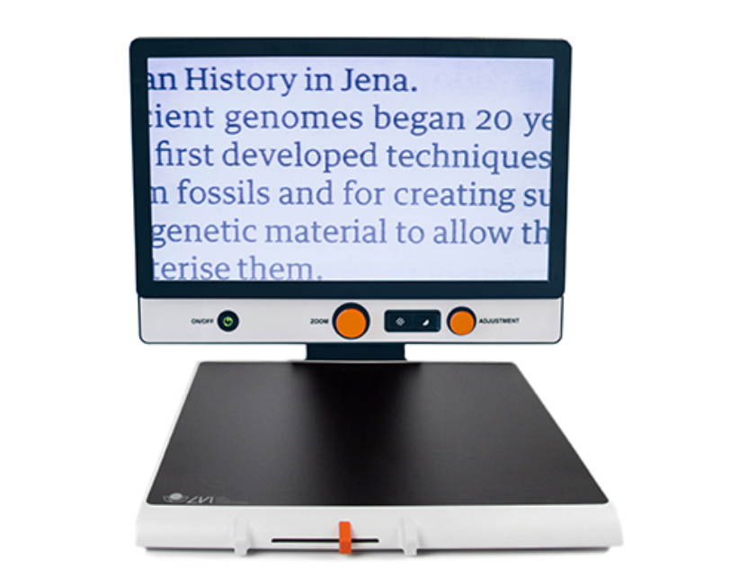 A Magnilink Vision  displaying text. The device has two orange buttons on the monitor bezel and a small orange accent on the front edge.