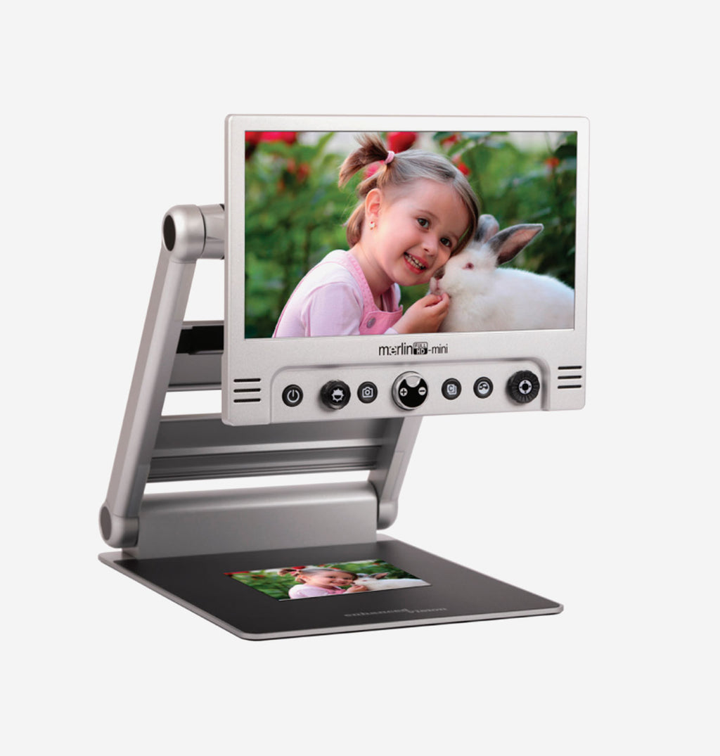 Merlin Mini HD displaying a child with a rabbit and another image on a white background