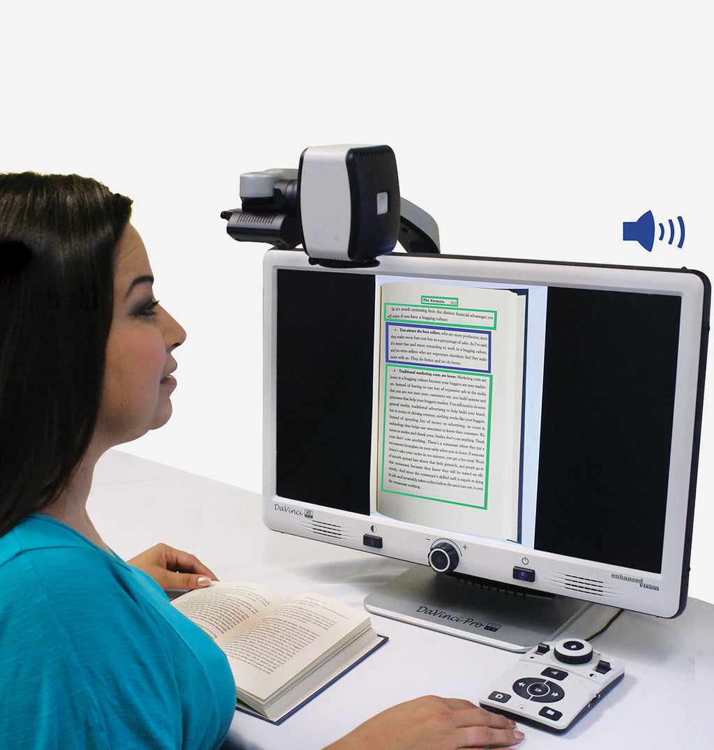 Woman sitting at desk using DaVinci to read a book