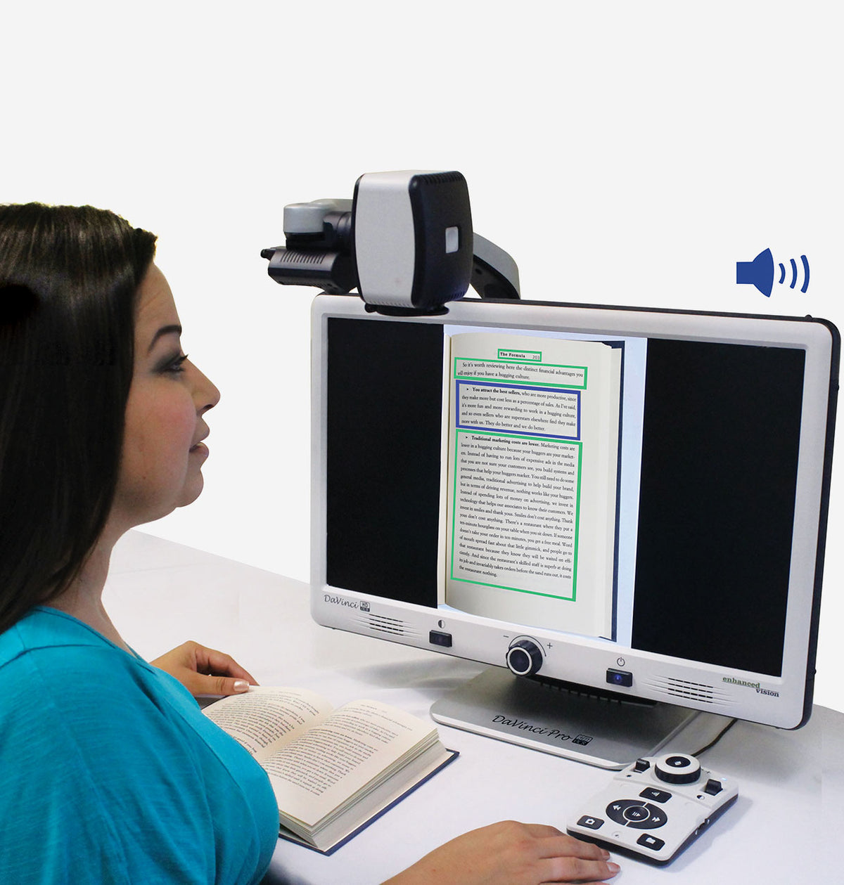 Woman sitting at desk using DaVinci to read a book