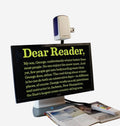 ONYX 24HD Desk Set with text magnifier and book on a white background