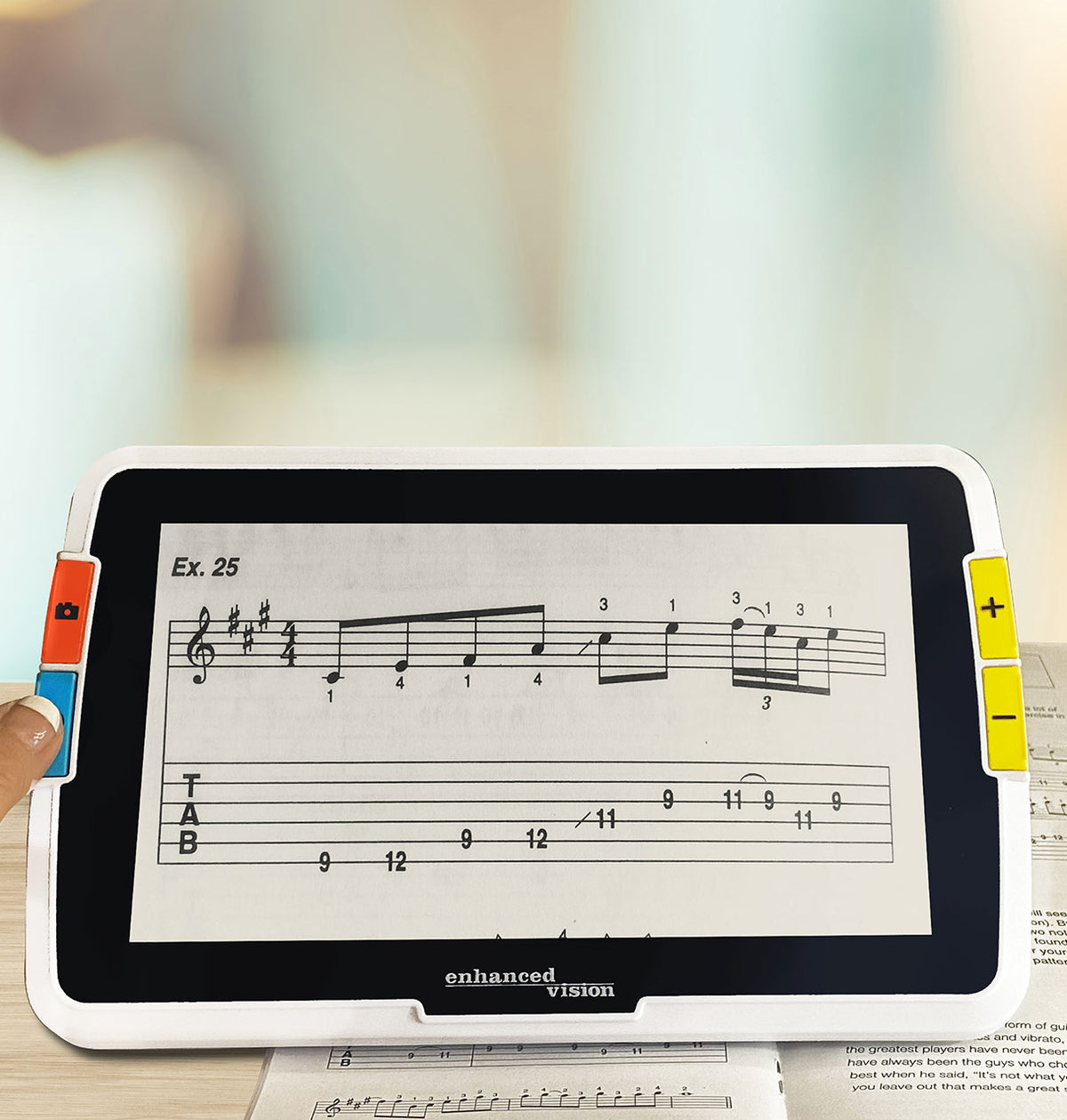 Amigo 8HD displaying music notation with 'enhanced vision' branding.