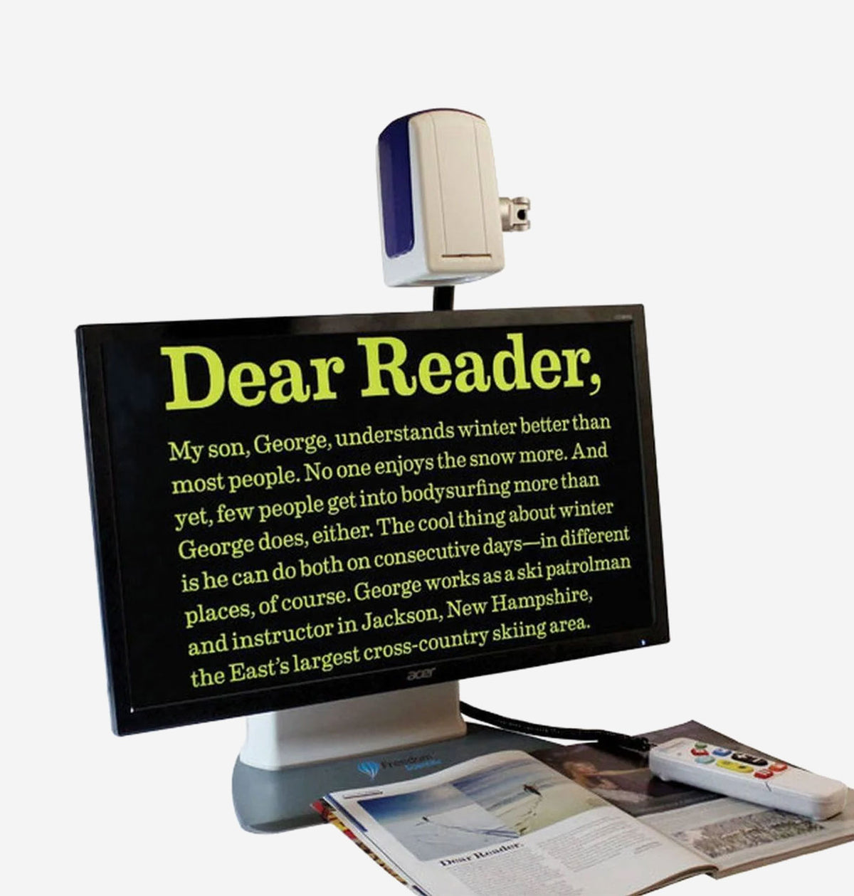 ONYX 22HD Desk Set with text magnifier and book on a white background
