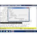A screenshot of a software interface showing a file emboss dialog box over a page layout workspace with Braille text and a Windows taskbar at the bottom.