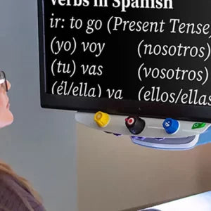 Person looking at a screen displaying Spanish verb conjugations